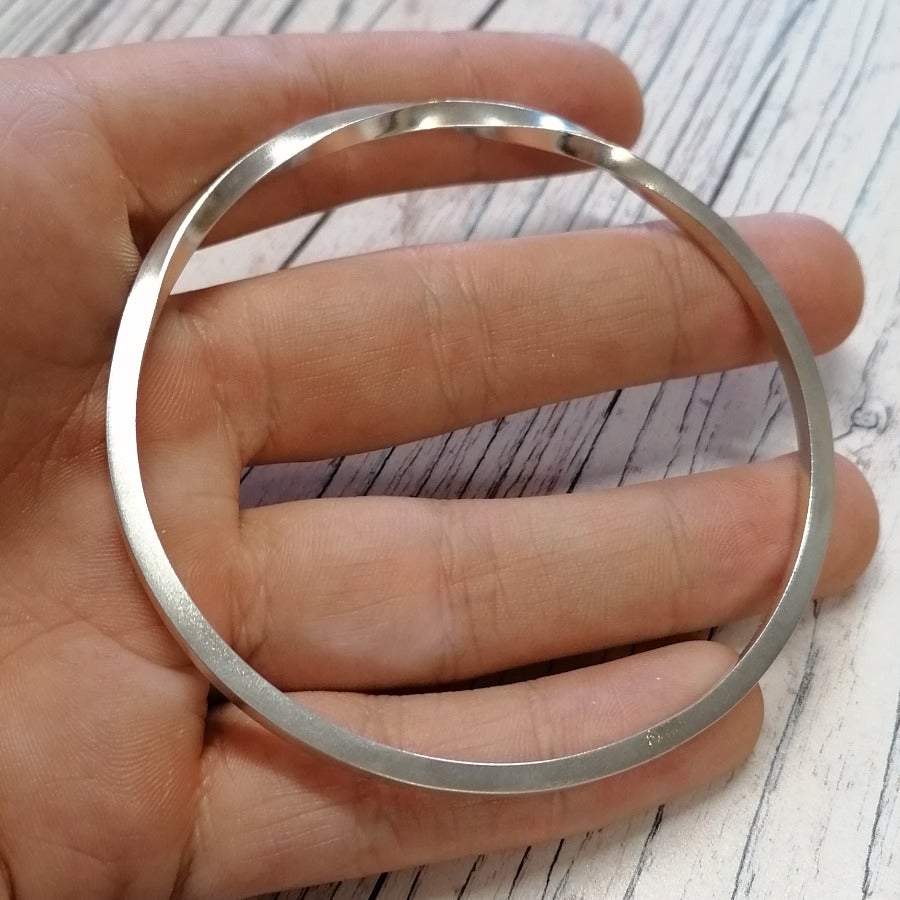 Solid silver continuous twist bangle