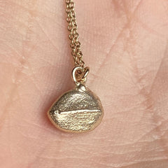 Solid Gold Lined Pebble Pendant