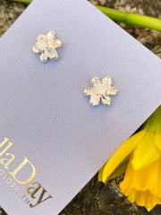 Tiny daffodil stud earrings in solid gold
